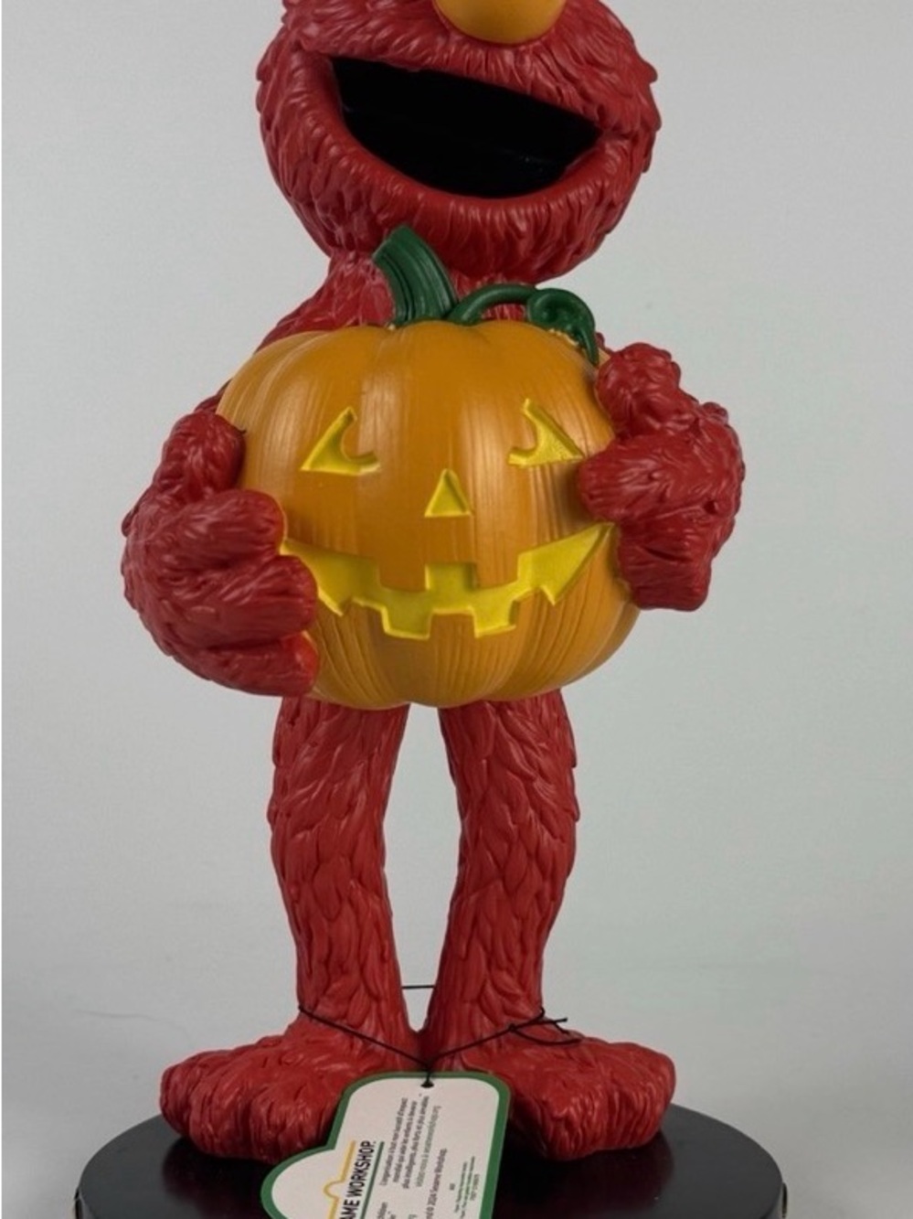 Sesame Street Red Elmo Figurine Holding Orange Jack-O'-Lantern